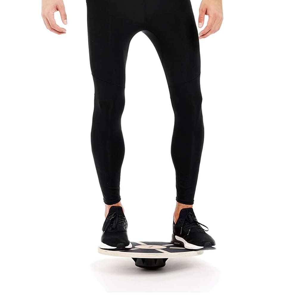 A person using AlephNeta CoreBalance on a balance board to improve stability and core strength.