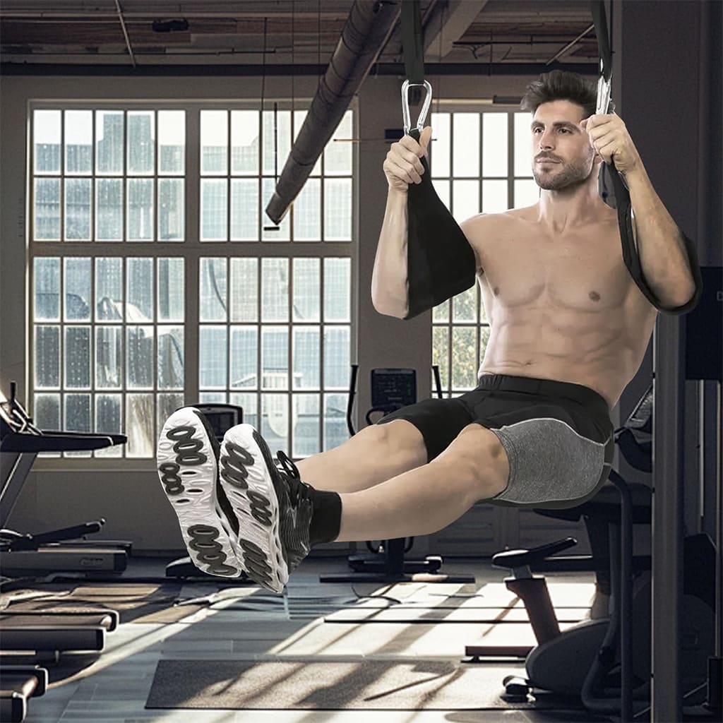 Man exercising with AlephNeta CoreStraps for abdominal strength training in a gym.